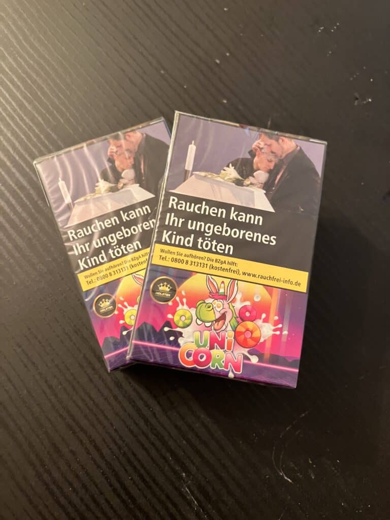 Rauchen kann das ungeborene Kind gefährden, Warnhinweis auf Zigarettenschachteln.